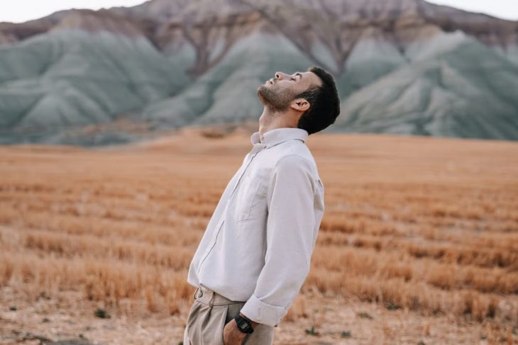 Man in white shirt enjoying tranquility in a scenic field in Nallıhan, Ankara, Türkiye.